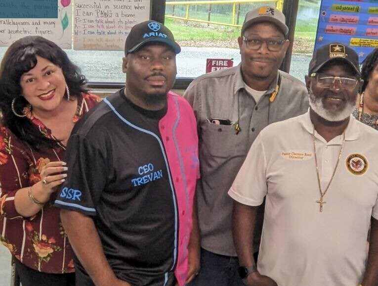 Clarence Reed with faculty and staff